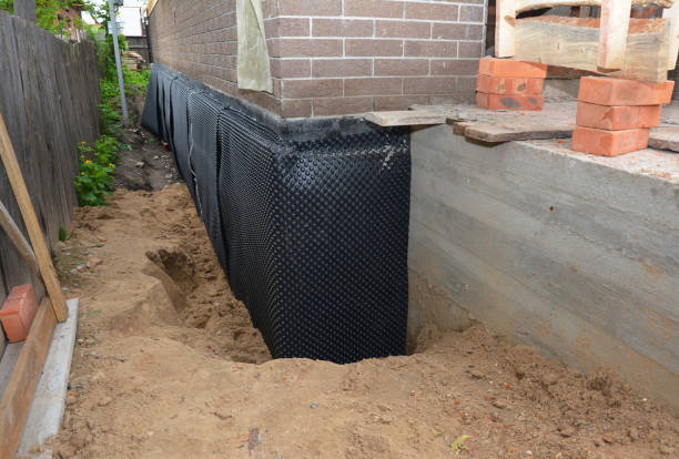 SJ Waterproofing Pros technician performing targeted Waterproofing assessment in Byrdstown, TN